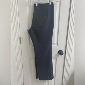 Charcoal colored straight leg women’s trousers.